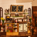 Book Nook „Holiday Café” – Stories in Books 3D puidust miniatuur - Image 3